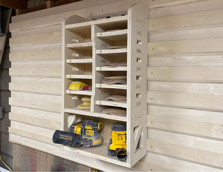 cnc router project french cleat sand paper storage cabinet made from plywood and cut on a avid cnc router machine for storing sandpaper disks and orbital sanders in a small wood shop workshop