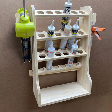 caulk tube storage organizer that holds 18 tubes of caulk and 2 caulking guns with a large shelf made of plywood on a cnc router project machine